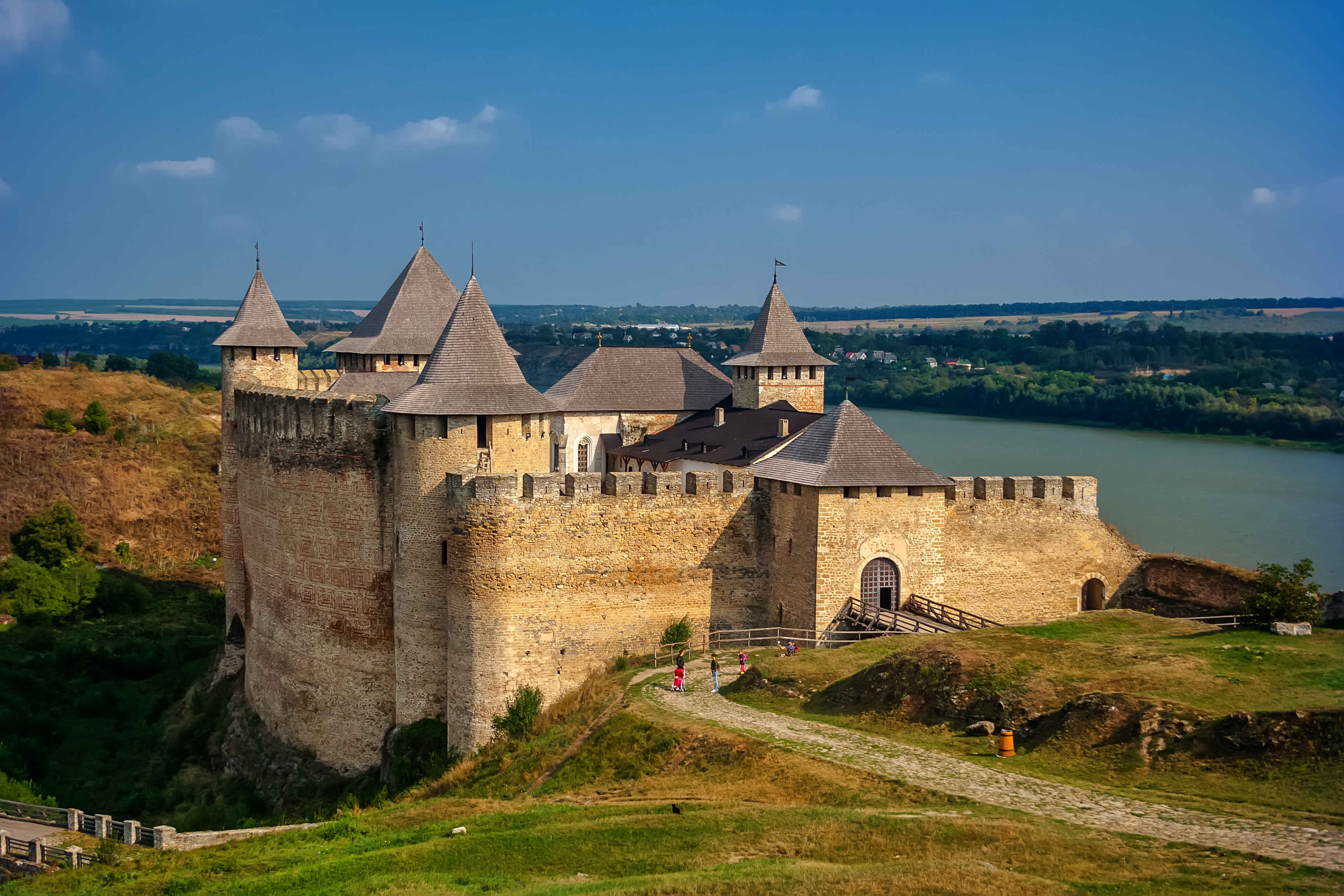 Khotyn fortress is one of the brightest historical and architectural monuments in Ukraine. At first, Prince Volodymyr Sviatoslavovych built a fort at this place in the 10th century and later a stone castle arose at the site due to King Danylo Halytskyi and his son Lev. Over the centuries, the stronghold changed its appearance. They made improvements, rebuilt and extended it a lot of times.